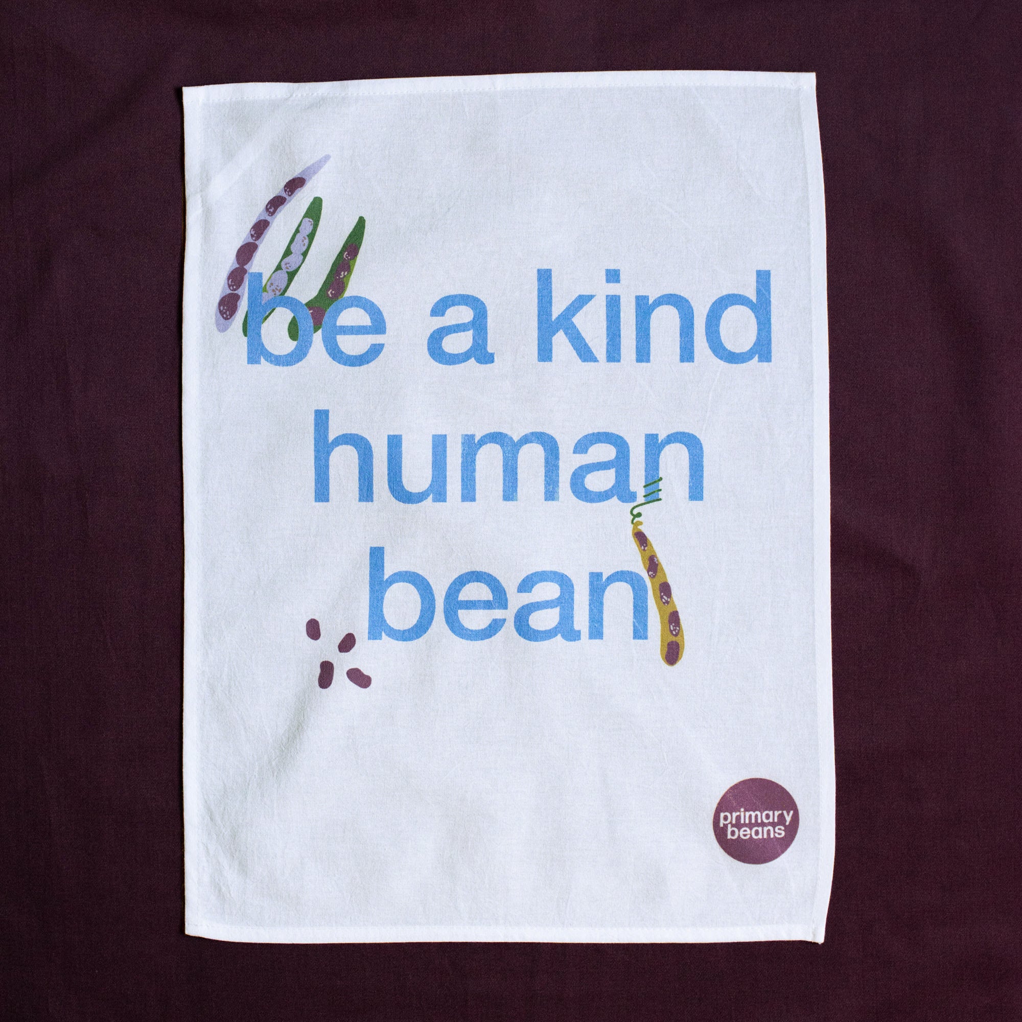 Be a kind human bean tea towel by Primary Beans